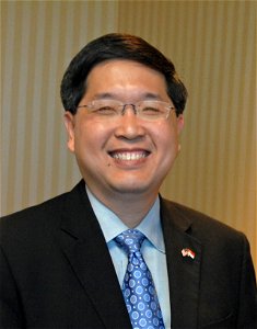 Retouched image of Lam Yi Young from the Singapore Maritime and Port Authority at a meeting with Vice Commandant Sally Brice O'Hara in Washington, D.C. (Original photo by U.S. Coast Guard)
