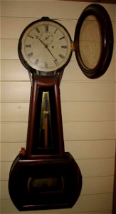 A picture of a banjo clock taken with a Canon PowerShot SD450 Digital Elph camera. Image was edited using a Paint Shop program on a laptop computer.
