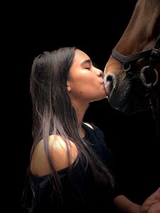 Girl horse kiss photo