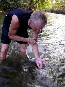 Image title: Aquatic biologist releases a threatened goldline darter Image from Public domain images website, http://www.public-domain-image.com/full-image/people-public-domain-images-pictures/male-me photo