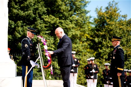 Prime Minister of the Republic of Albania Edi Rama, center, lays a wreath at the Tomb of the Unknown Soldier in Arlington National Cemetery, April 13, 2016, in Arlington, Va. Rama also toured the Memo