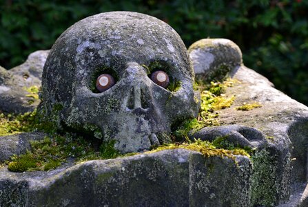Skull and crossbones stone sculpture skull
