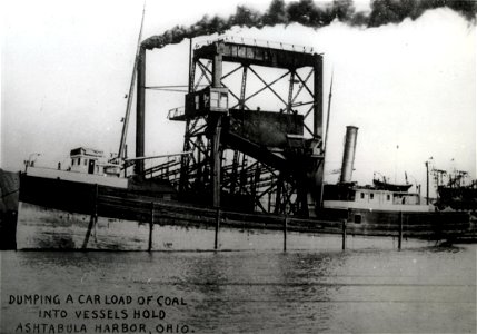 Dumping A Car Load Of Coal Into Vessel's Hold photo
