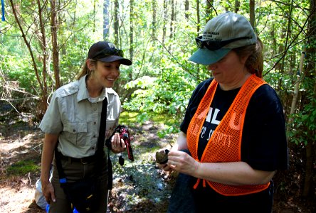 Chelsea McKinney with the U.S. Fish and Wildlife Service (left) stands with Dr. Carol Bocetti of the California University of Pennsylvania. The Delmarva Peninsula fox squirrel is in a fabric cone that photo