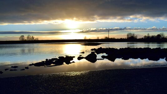 Sunset mirroring waters photo
