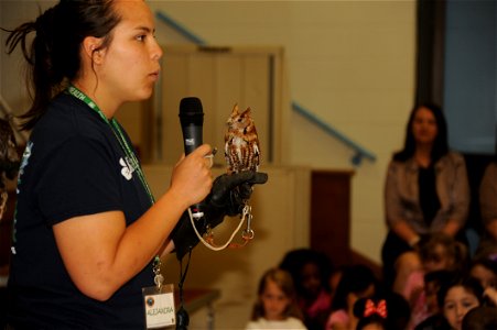 Alejandra Palacio, Alabama 4-H Science School environmental educational instructor, educates Maxwell Elementary and Middle School students about the Eastern Screech Owl during the Birds of Prey demons photo