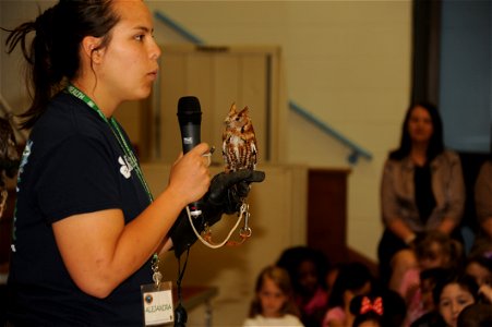 Alejandra Palacio, Alabama 4-H Science School environmental educational instructor, educates Maxwell Elementary and Middle School students about the Eastern Screech Owl during the Birds of Prey demons