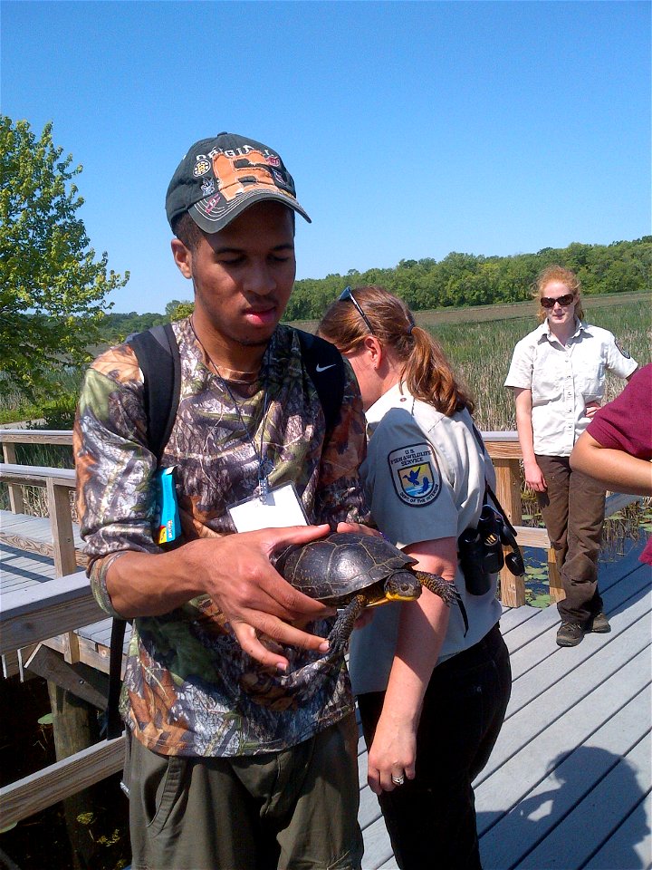 Ryan holding the Blanding's Turtle. 


Credit: Juancarlos Giese/USFWS