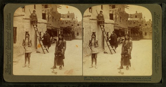 Medicine men, with squirming rattlesnakes - odd homes of the Cliff Dwellers.