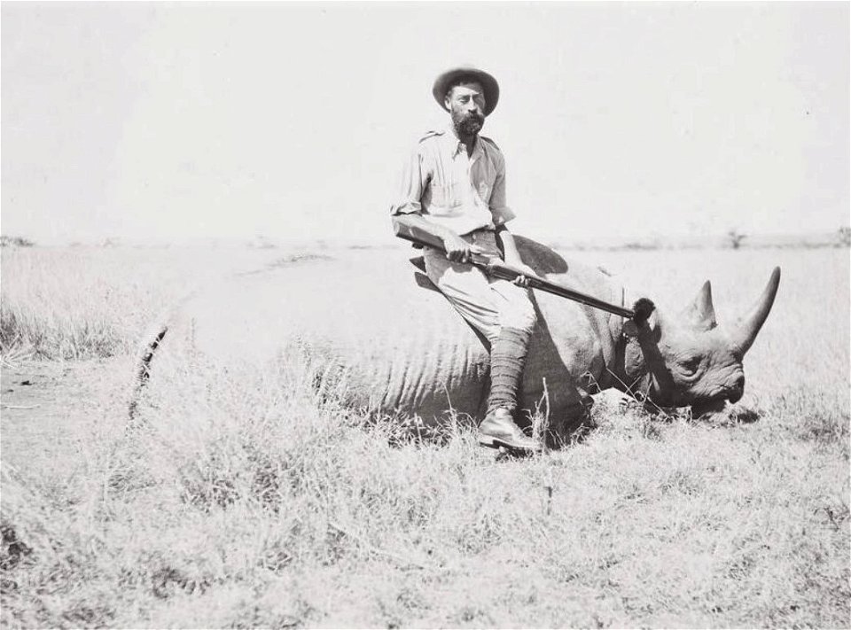 Richard John Cuninghame poses with a killed rhinoceros