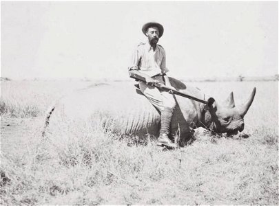 Richard John Cuninghame poses with a killed rhinoceros photo