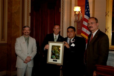 Assignment: 48-DPA-N_FWS_PR_Parrot] Reception, [attended by Fish and Wildlife Service Director H. Dale Hall and other Interior officials, publicizing the] Puerto Rican Parrot Recovery Program, [a coop photo