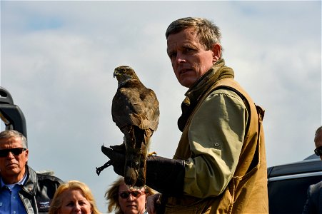 Jens Fleer, a falconer, shows his gyrfalcon used for flightline bird abatement on Spangdahlem Air Base, Germany, to a group of Air Force civic leaders April 19, 2016, during a weeklong civic leader tr