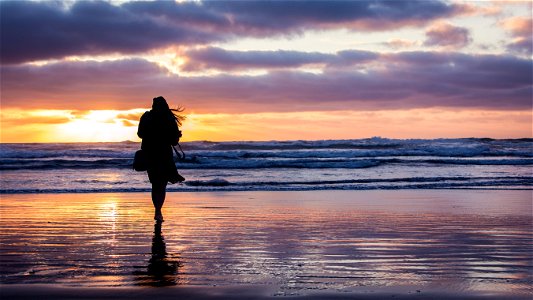 Woman Beach Sunset photo