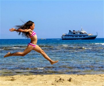 Girl Jumping Beach Ship