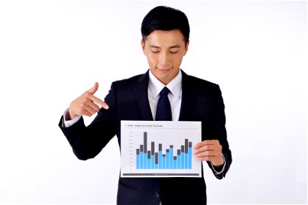 Businessman Pointing Graph photo