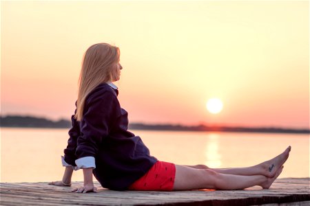 Woman Sitting Sunset photo