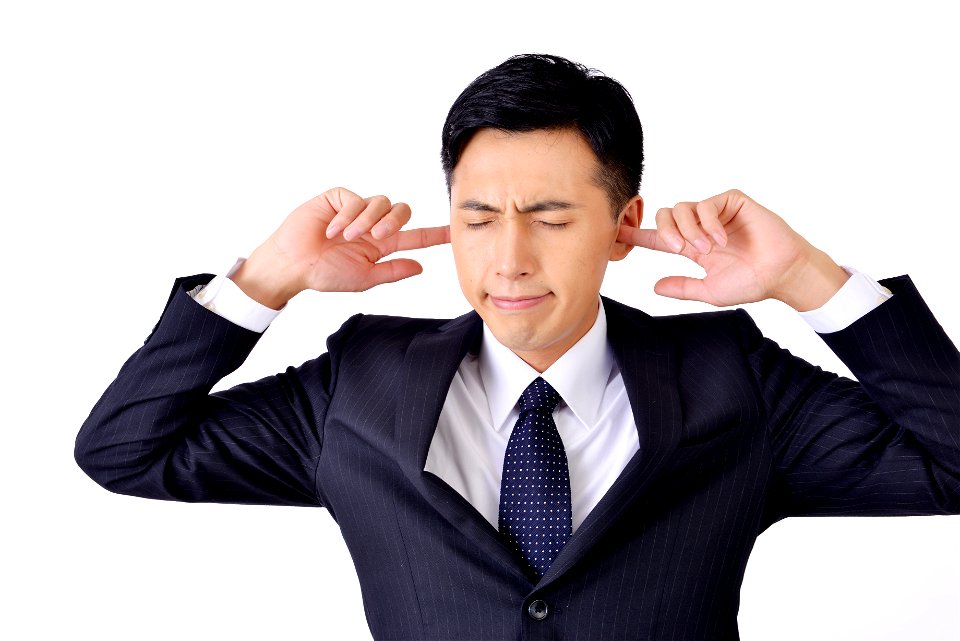 Businessman Stopping Ears