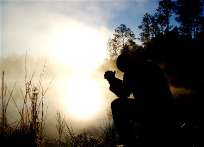 Man Praying Fog Lake photo