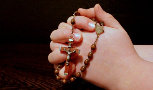 Hand Praying Rosary photo