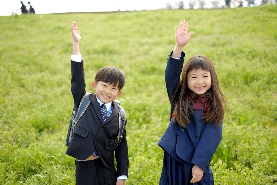 Schoolchildren Raising Hand