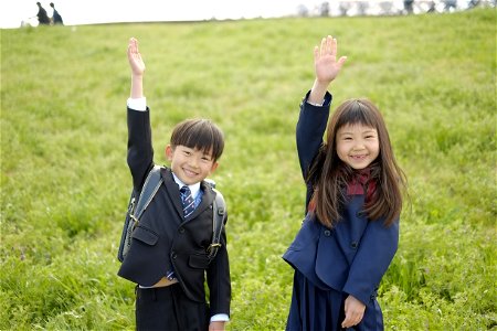 Schoolchildren Raising Hand photo