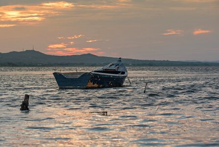 Boat sea sunset photo