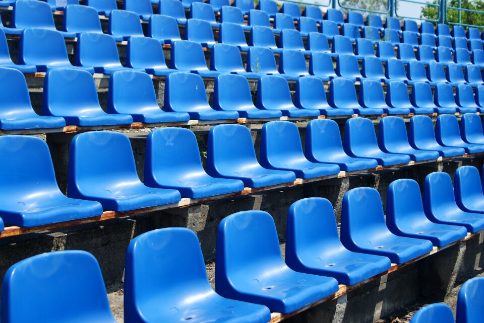 Tribune viewers sit