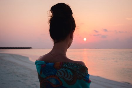 Woman on the Beach at Sunset photo