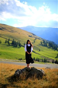 Girl standing in front of Mountain photo