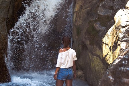 A girl and a waterfall photo
