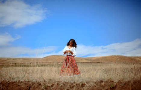 Girl standing in a Field photo