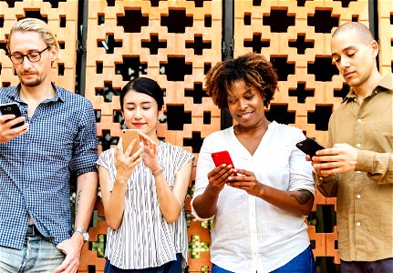 Group of diverse people using smartphones photo
