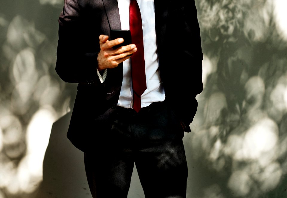 Businessman using mobile phone communication technology photo
