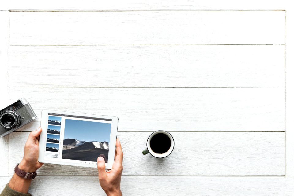 Aerial view of digital tablet on wooden table photography hobby concept photo