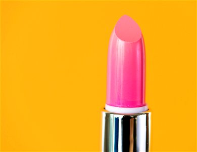 Closeup of pink lipstick for women photo