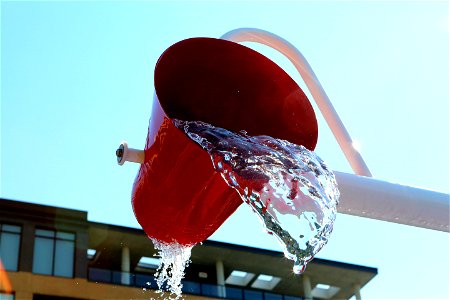 Bucket spilling water photo