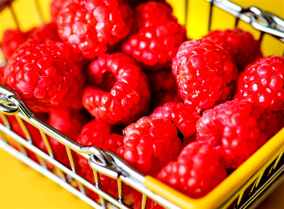 Fresh raspberries in a mini basket photo