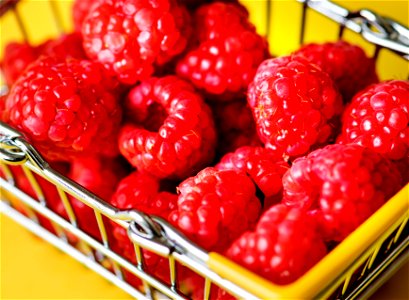 Fresh raspberries in a mini basket photo