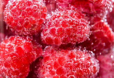 Close up bunch of fresh raspberries photo