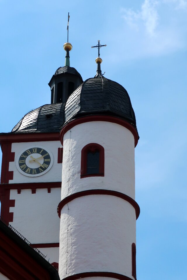 Church steeple peaks clock tower