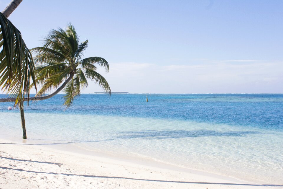 Atoll white sandy beach shadow
