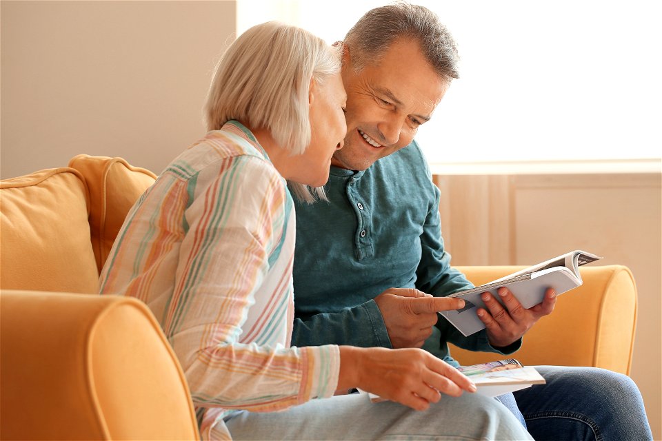 Senior Couple Sofa Book