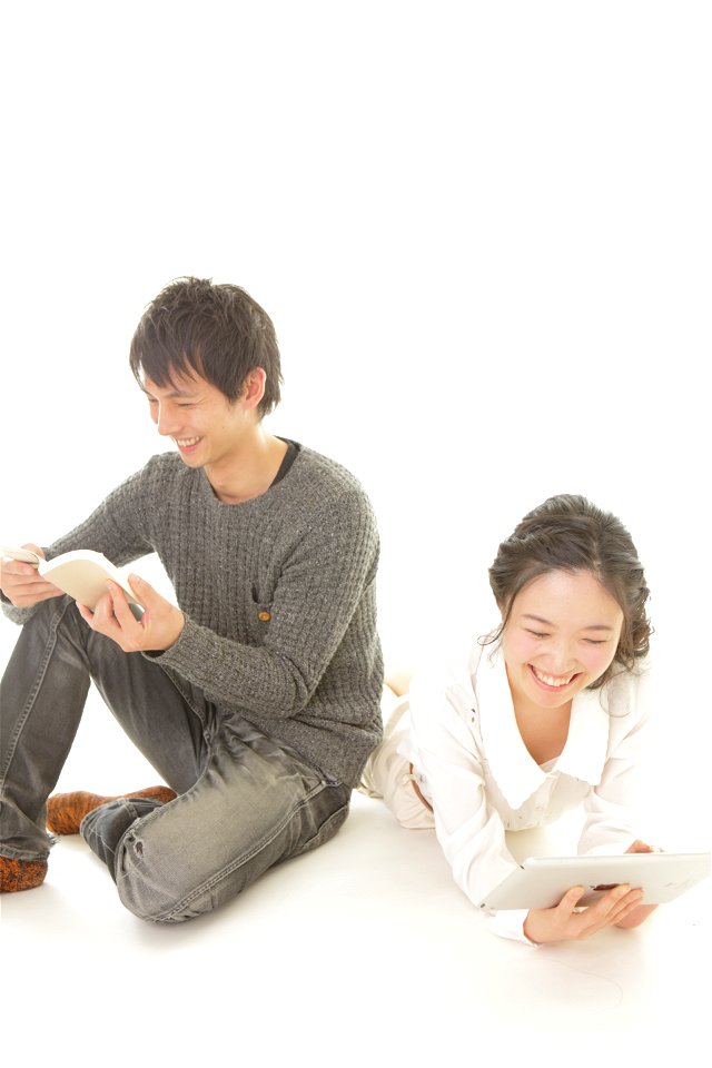 Couple Reading Book Tablet Pc