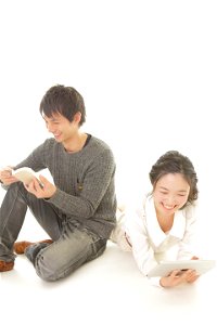 Couple Reading Book Tablet Pc photo