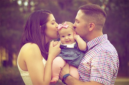 Father Mother Baby Kiss photo