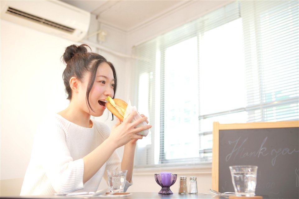 Woman Eating Sandwich