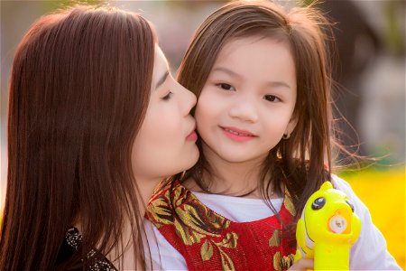 Mother Daughter Kiss