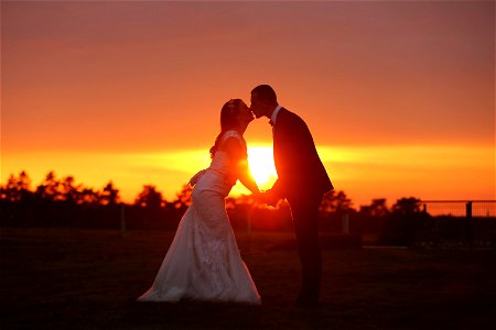 Bride Groom Kiss Sunset photo
