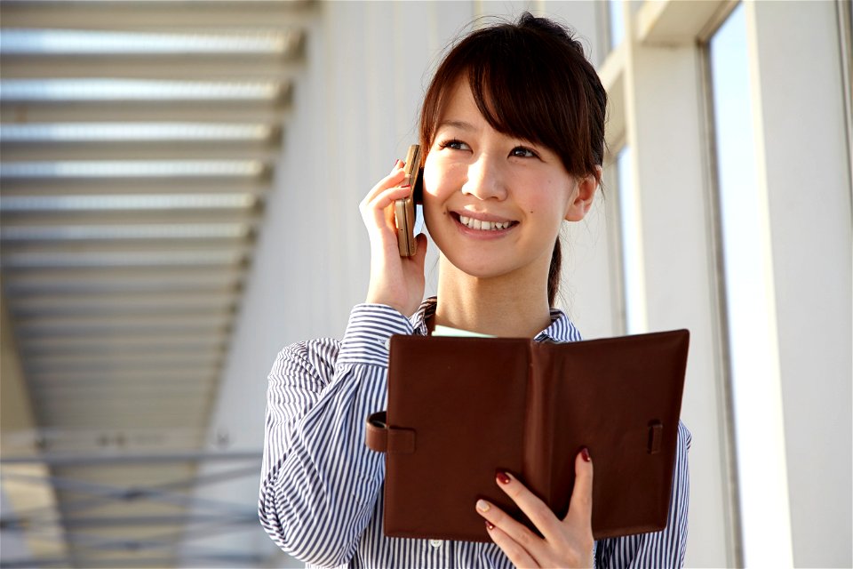 Businesswoman Mobile Phone Notebook